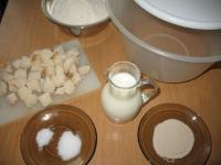 Pour warm milk into the kneading bowl, add sugar,...