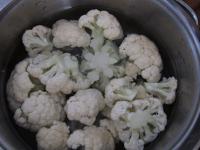 Cut the cauliflower from the middle into smaller...