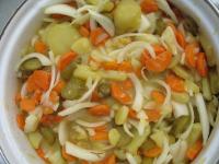 Mix potatoes, carrot, onion, cucumbers and pour...