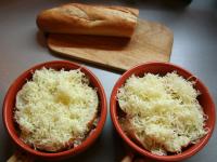 Pour soup in baking dish, put rings of baguette on...