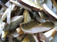 Clean mushrooms, remove needles and leaves from...