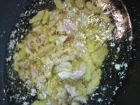 Heat oil in a wok. Add pork and fry at medium heat...