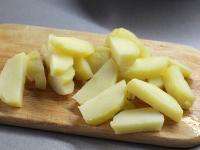 Cook potatoes in their skins in water until almost...