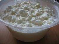 Pour cooked milky cream over the fluffy meringues,...