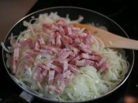 Cut onion into thin half-rings. Roast it for a...