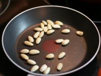 Fry peeled almonds on a smaller pan until golden...