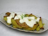 Mix bryndza with sour cream. Serve on warm baked...