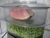 Pour frozen or fresh peas into the bottom basket...