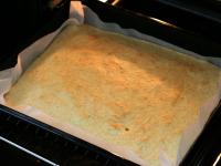 Pour the dough on a baking sheet lined with...