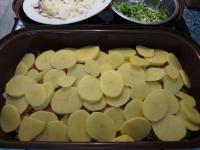 Spread second third of potatoes, evenly salt it....