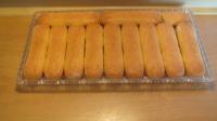 Place long biscuits on tray and pour half amount...