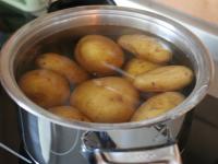 Boil the potatoes with skin and wit 1 tsp of salt...