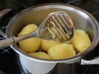 When cool, peel potatoes and shred them, making...