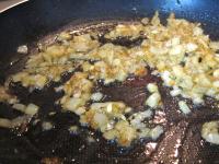 Add oil to the butter, also finely chopped onion...