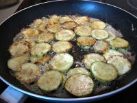 Clean the zucchini, cut it into thin rings.Melt...