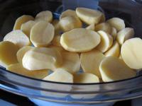 Clean potatoes, wash and cut in half. Put them in...