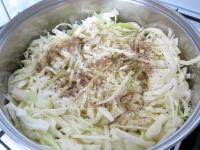 Add chopped cabbage, salt and caraway into the...