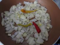 Peel onion, chop it and cook in hot oil. Add...