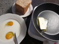 Beat the eggs in a milk. Heat knob of butter in...