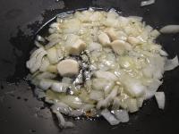 Heat oil in a wok and add cleaned, chopped onion...