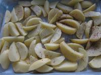 Clean the potatoes and put them on a baking sheet...