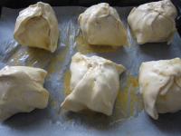 Place apple bundles in the baking tin lined with...