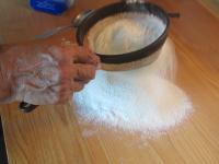 Sift the flour through the sieve to the working...