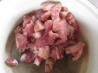 Cleanse pork, cut the very fat parts off and cut...