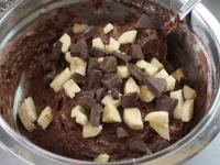 Add pieces of chocolate and sliced banana to the...