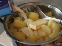 Drain cooked potatoes. Add butter, milk and mash...