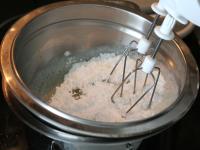 In double boiler whisk egg whites together with...