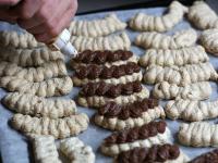 Spray cream with confectionery onto the baked...