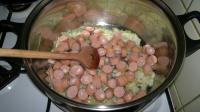 Add sausages sliced into rounds and cook for a...