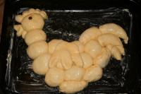 Place buns on a greased tray in shape of cockerel,...