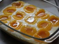 Lay peeled halved peaches on top....