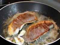 Add fillet of Tilapia into the melted butter and...