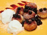 Serve croquettes with whipped cream and blueberry...