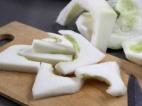 Peel away the rind of the pattypan squash and use...