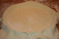 Use a rolling pin to spread the puff pastry into...