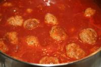 Place balls into the sauce, add meat bouillon and...