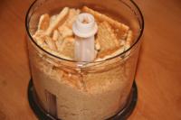 Grind biscuits in a food processor or with a...