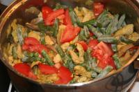 Then add finely chopped tomato and green beans....