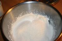 Whip egg whites and carefully blend in sugar,...