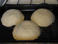 Place the bowls with the dough at the baking...