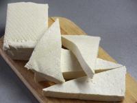 Cut tofu lengthwise into halves, each half into...