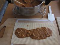 Place one wafer on a wooden kitchen board. Evenly...