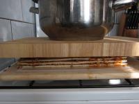 Lay second wooden kitchen board on the wafers and...