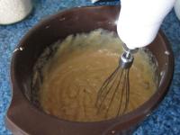 Add pudding and rum to the butter. Mix until you...