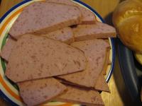 Cut the meatloaf into slices and cut it...