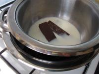 Melt chocolate in milk over the water bath. ...